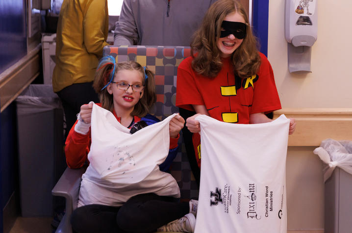 image of patient and her family with trick or treat bags
