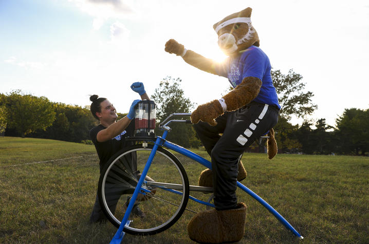The Wildcat celebrates after pedaling to make a smoothie. Photo by Carter Skaggs