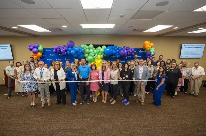Photo of providers at Clark Regional Medical Center Group photo of ribbon cutting under colorful balloon arch