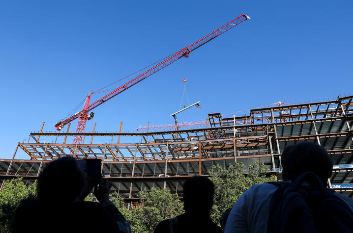 The crowd watches the final beam be placed during UK's "topping out" ceremony for the Health Education Building. Carter Skaggs | UK Photo