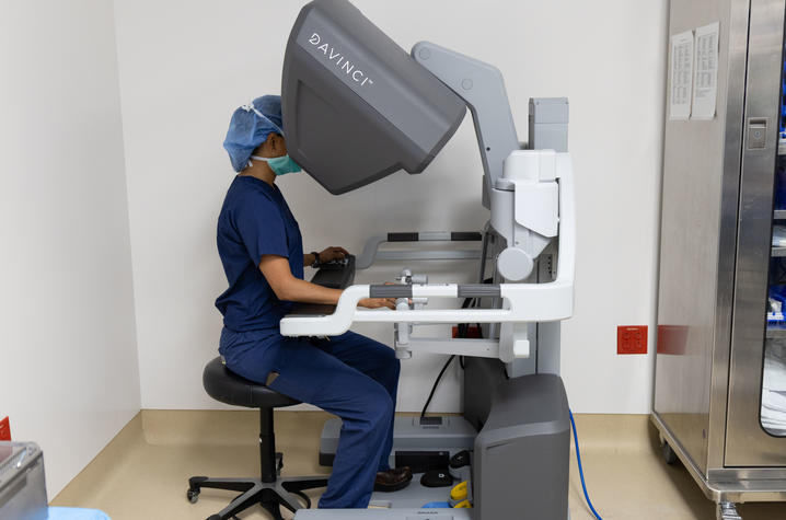 Image of Dr. Shah using the robot control console