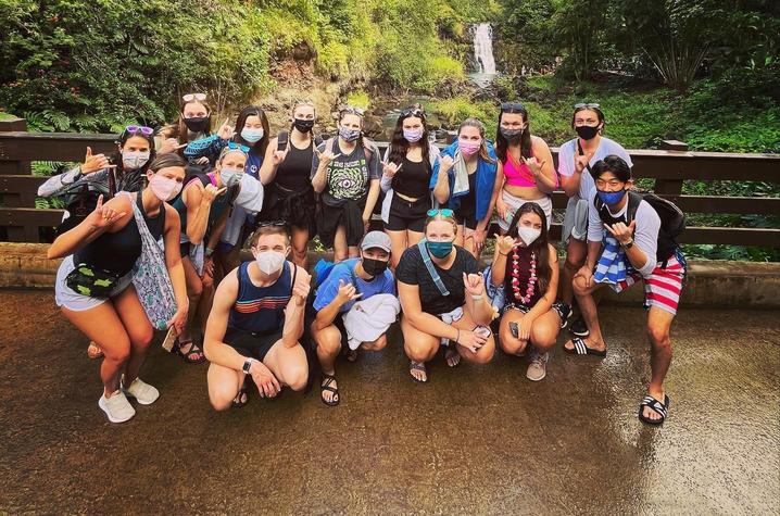 Group of students in front of local waterfall