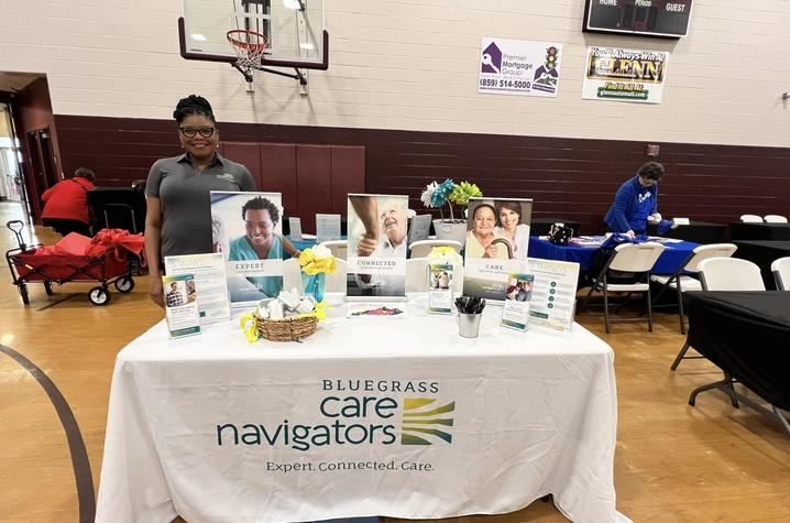 Image of Ashley with table featuring the services of Bluegrass Care Navigators