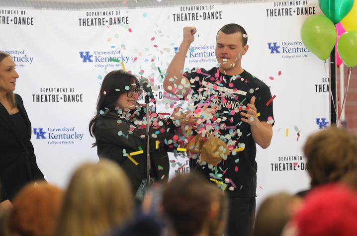 Students popping a balloon at UK Theatre and Dance season reveal event