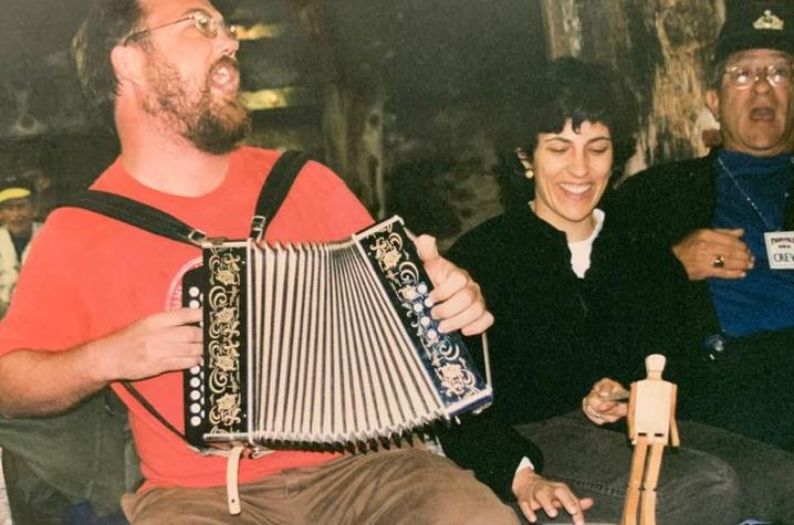photo of Revell Carr playing accordion and singing sea chanteys