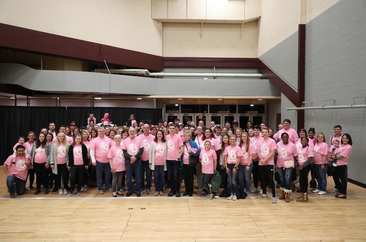 Image of group of people wearing pink shirts to honor Jared's legacy