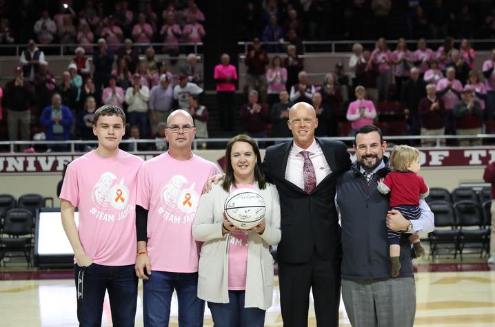 image of Chitwood family with Coach Hamilton at EKU basketball game
