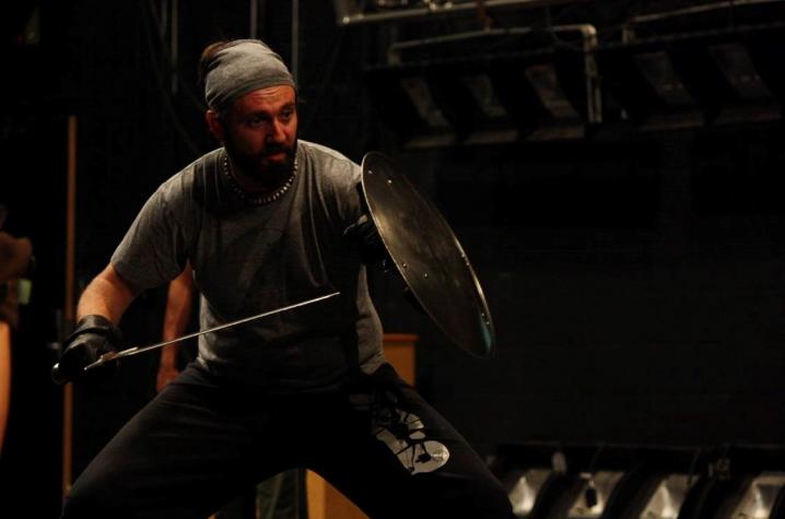 Andrew Dylan Ray with shield and sword