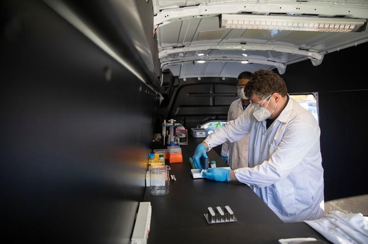 Scott Berry in mobile lab testing wastewater samples