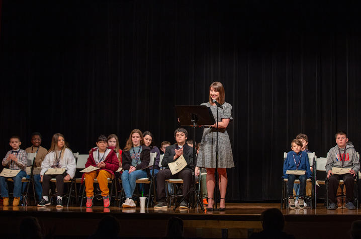 Students on a stage for a spelling bee