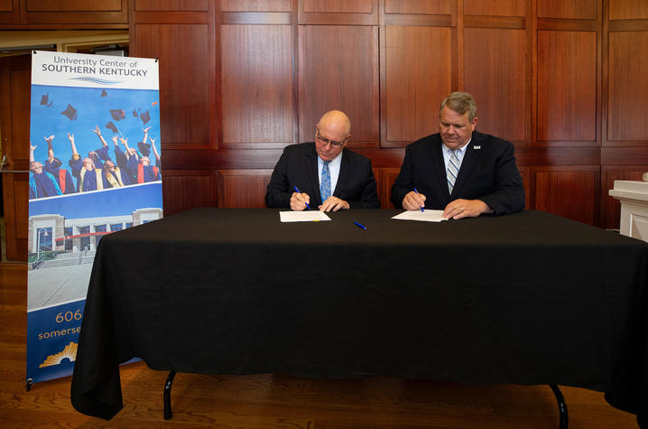 photo of UK Provost David W. Blackwell and Somerset Community College President Carey Castle signing a memorandum of understanding with the University Center of Southern Kentucky.  Mark Cornelison | UK Photo.