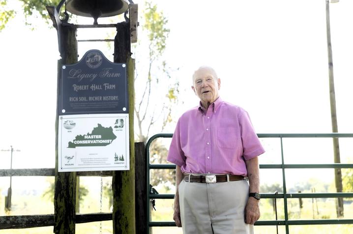 Bob Hall in front of farm 