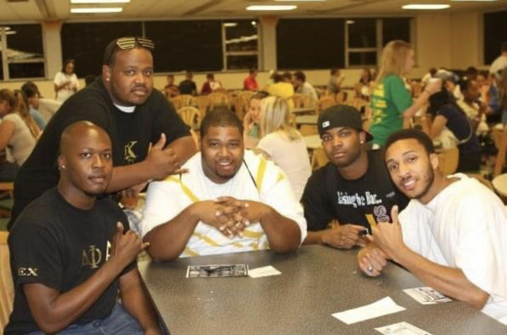 Mitchell, pictured second from right, with friends in the old Student Center on campus.