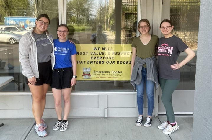 medical students standing outside of the northern kentucky homeless shelter