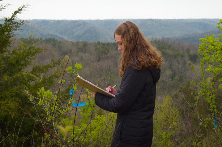 Callie Black conducts research