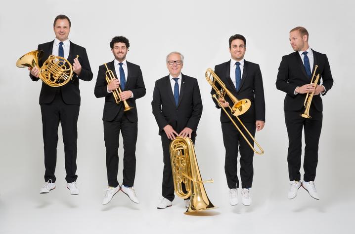 photo of Canadian Brass with instruments jumping