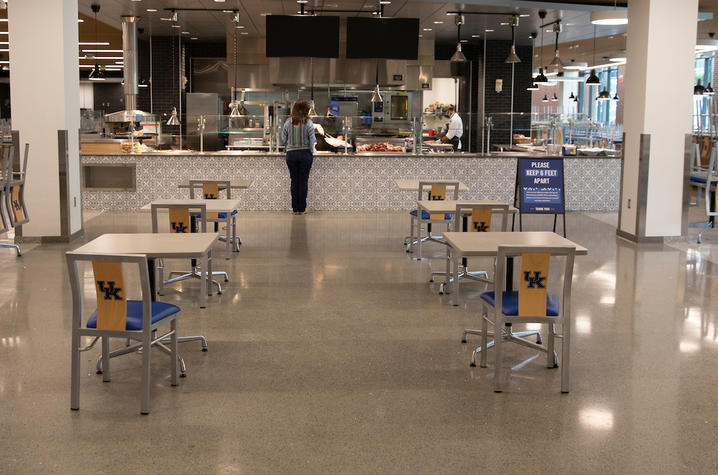 photo of Champions Kitchen during pandemic with tables spaced out for physical distancing