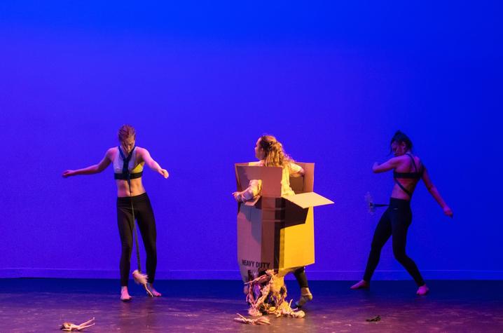 photo of 3 dancers including one in box from "Choking Hazard" by Cecilia Pont