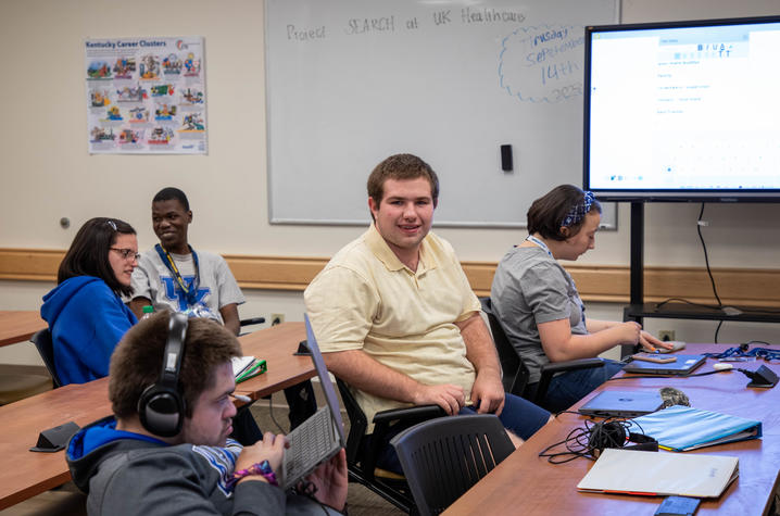 Students sit at desks in a classroom at UK Hospital as part of Project SEARCH.