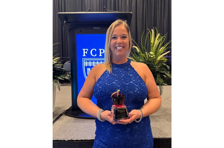 Megan Chestnut accepted the award on behalf of University of Kentucky Department of Ophthalmology and Visual Sciences . Photo Provided by Megan Chestnut.