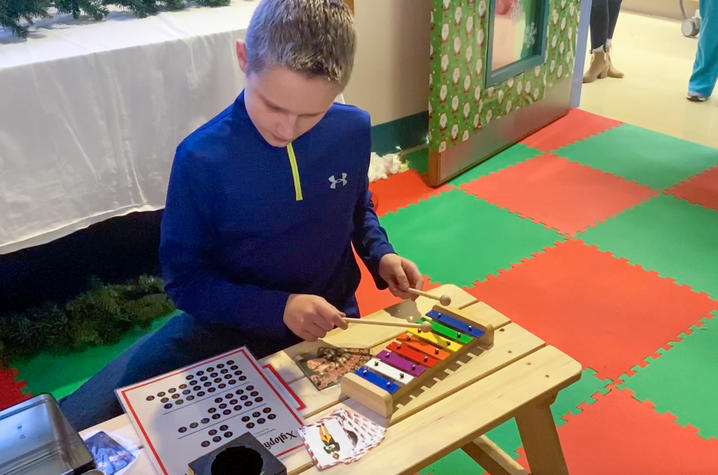 photo of dalton green playing toy xylophone