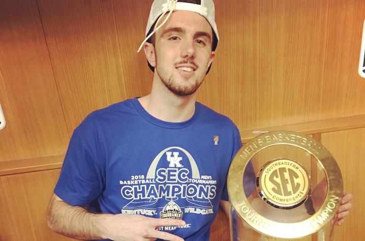 photo of Dillon Pulliam and SEC trophy