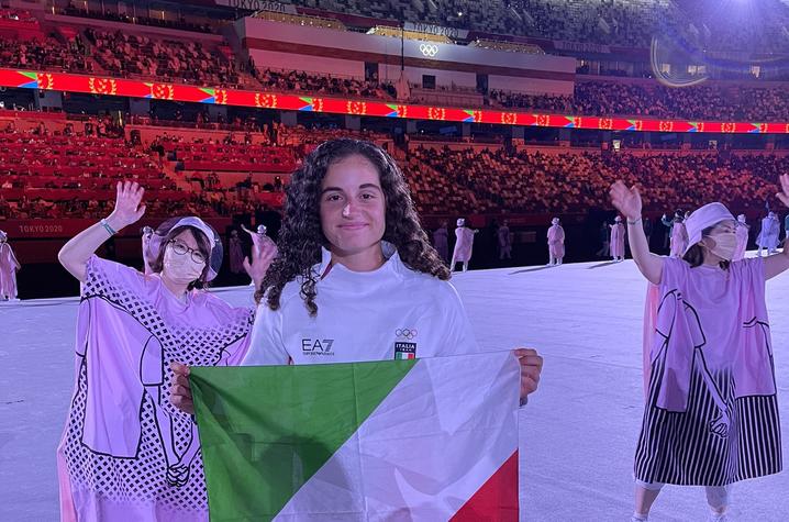 photo of Alexia Lacatena poses with Italy's colors during the Olympics opening ceremony