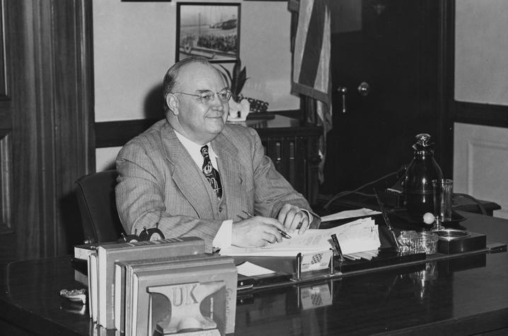 photo of Governor Earle C. Clements at desk