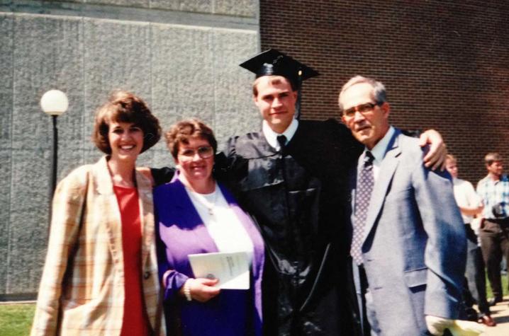 a family standing together after a college graduation