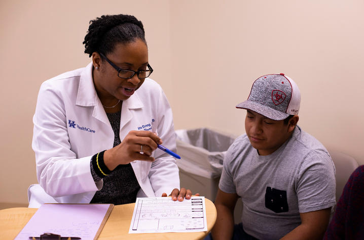 Photo of Dr. Ima Ebong with patient Zack Price