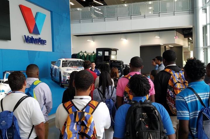 photo of students from FASTrack program listening to Valvoline speaker