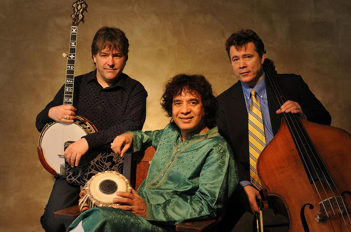 photo of Bela Fleck, Edgar Meyer (seated) and Zakir Hussain with instruments