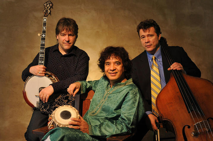 photo of Bela Fleck, Zakir Hussain (seated) and Edgar Meyer with instruments