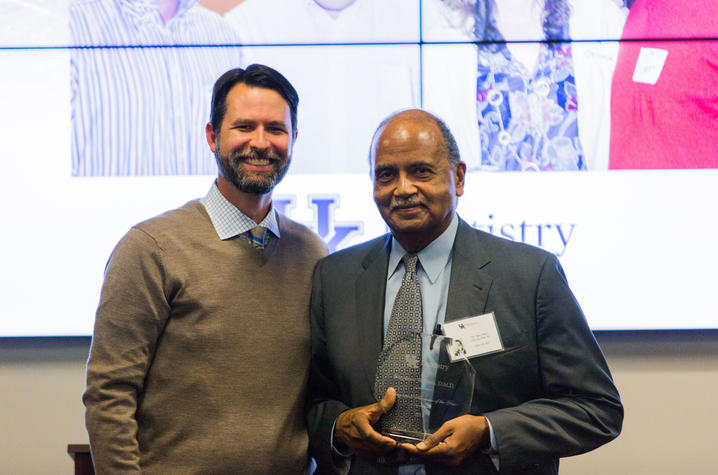 Dr. Nero accepts his Alumni of the Year award from UKCD, 2017