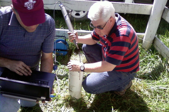 KGS Water Resources Section Head Chuck Taylor and Steve Webb install water monitoring equipment for the Kentucky Groundwater Observation Network.