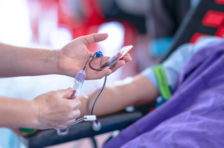 photo of someone's arm while giving blood