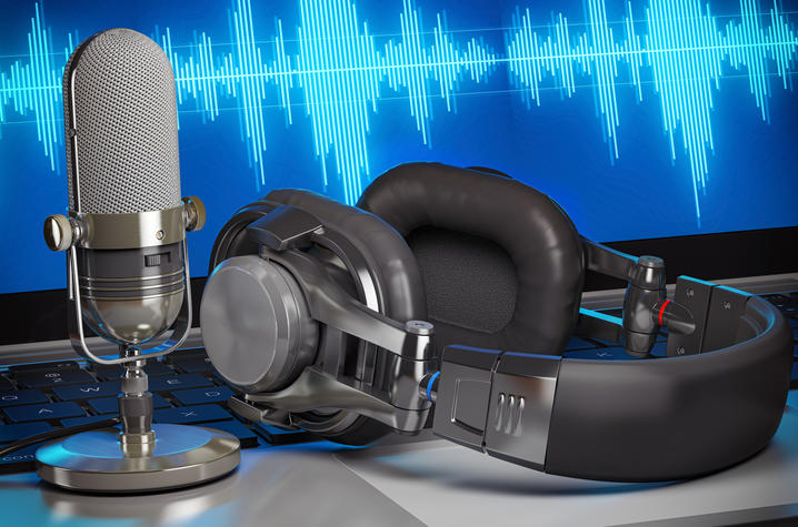 stock photo microphone, headphones and a screen with airwaves in blue