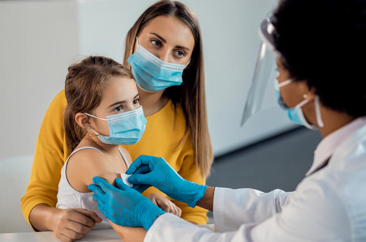 stock image of little girl getting vaccination
