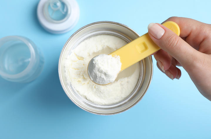 Image of a scoop of powdered baby formula