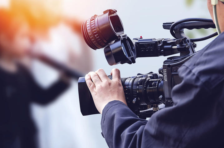 Getty Image of Photographer with TV Camera