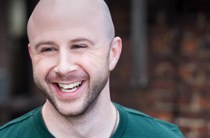 headshot photo of Grady Bowman in dark green short sleeve T-shirt