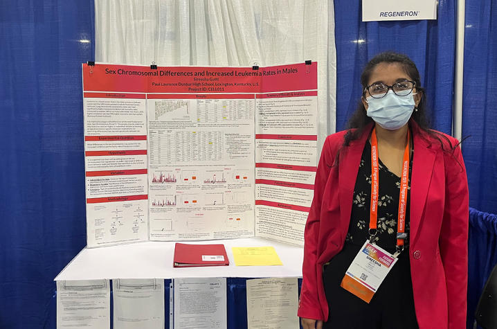 sireesha gutti standing next to her winning science fair project