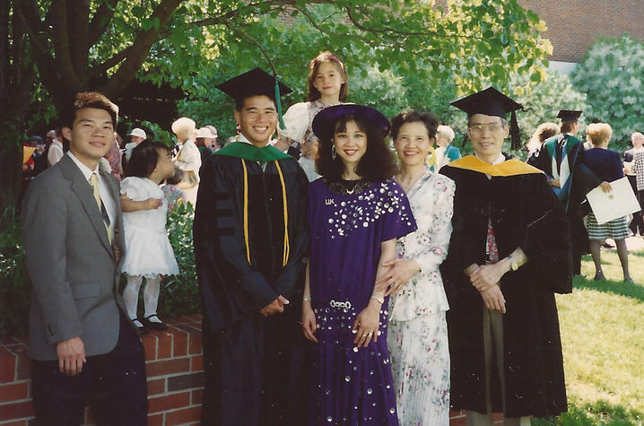 UK College of Medicine graduation in 1993. L to R: John Huang, brother, Katie Huang, John's daughter, Michael Huang, Hannah Johnson, niece, Mary Ensom, sister, Jane Huang, mother, and Yang "Pete" Huang/