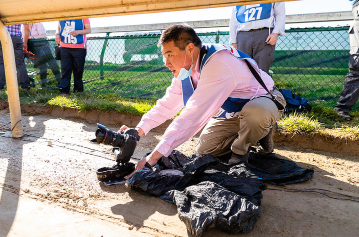 Michael Huang under the rails at the 2021 Kentucky Derby.