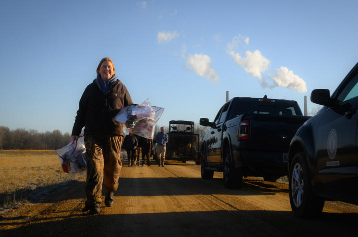 Haley Taylor carries bags with research materials Haley Taylor carries bags with research materials