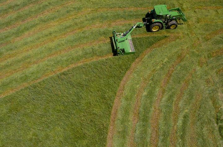 Tractor bailing hay