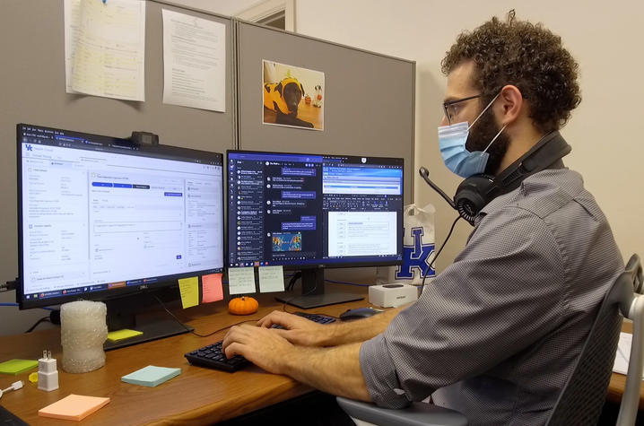 UK Health Corps wellness connector Evan Ayoub at desk