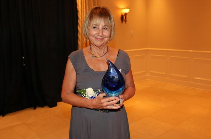 photo of Kay Hoffman with College of Social Work Hall of Fame award