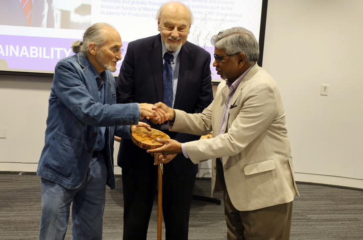  (From left): Richard Levine and Ernie Yanarella presented Ibrahim Jawahir with the Yanarella Levine Legacy Award. Photo provided. 
