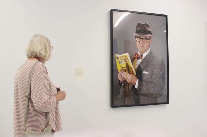 photo of visitor looking at "What I Read (The Grapes of Wrath)" by Louis Zoellar Bickett
